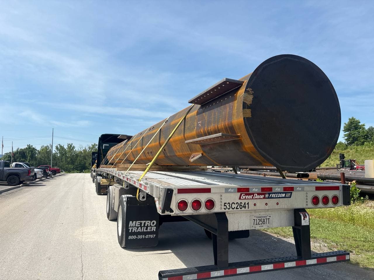 Large steel cylinder on a flatbed trailer